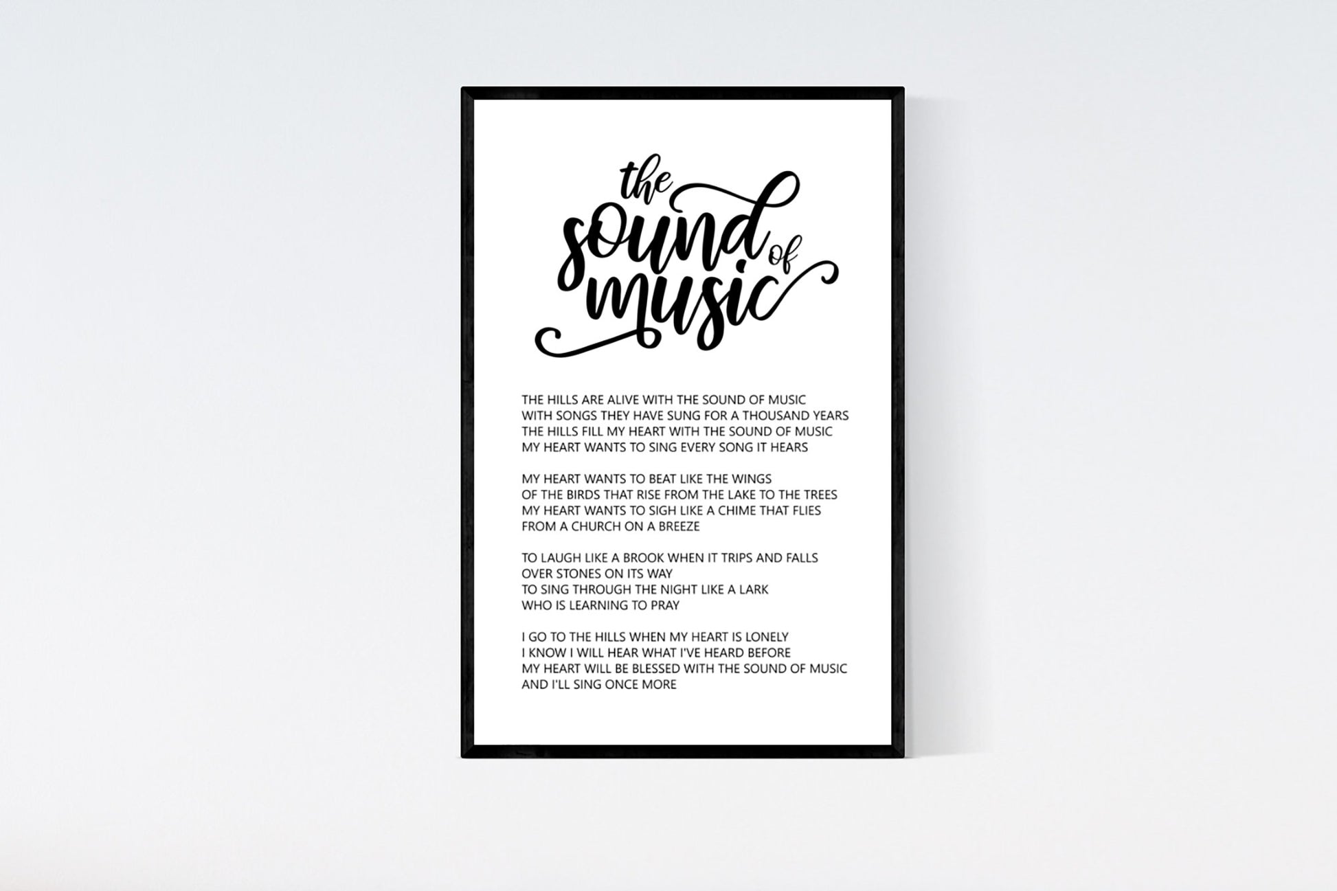 The Sound of Music art print with black and white minimal style and full lyrics "The hills are alive with the sound of music"